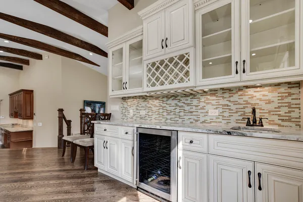 a kitchen with stainless steel appliances granite countertop a sink and cabinets