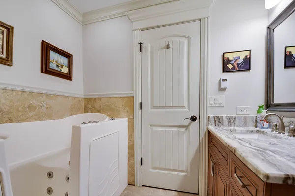a bathroom with a sink a vanity and a mirror