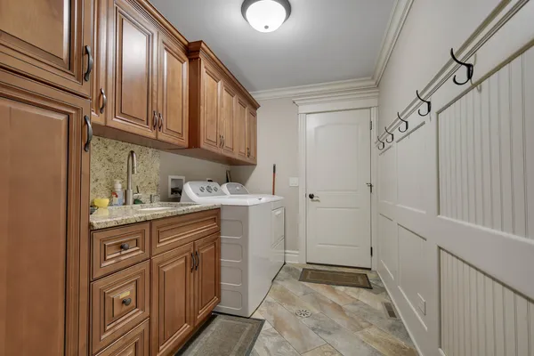 a kitchen with cabinets and window