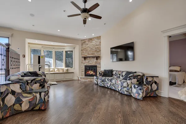a living room with furniture flat screen tv and a fireplace