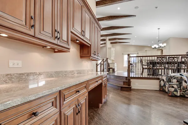 a kitchen with stainless steel appliances granite countertop a sink and cabinets