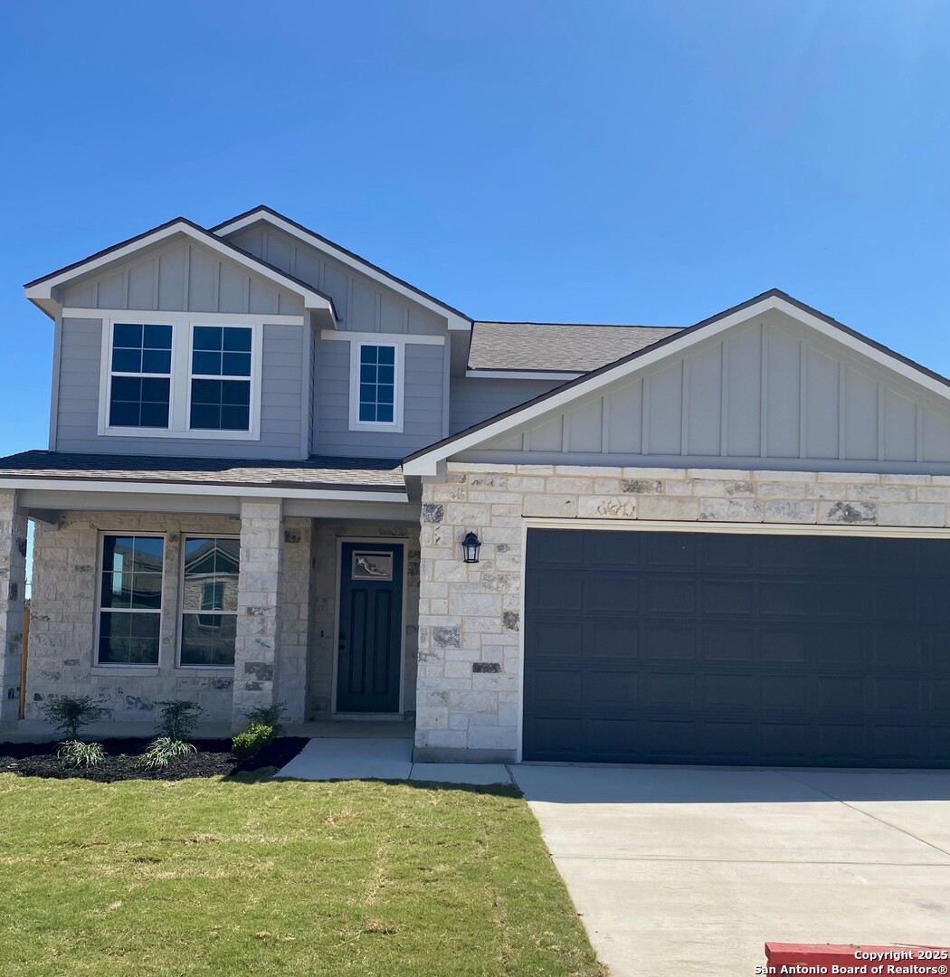 7010 Walkers Loop Live Oak, TX 78233 - Photo 1 of 13 a front view of a house with garage