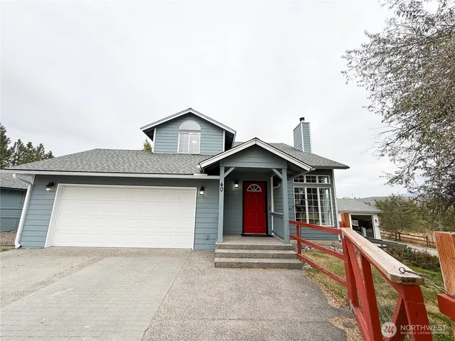 a view of house with outdoor space and trees