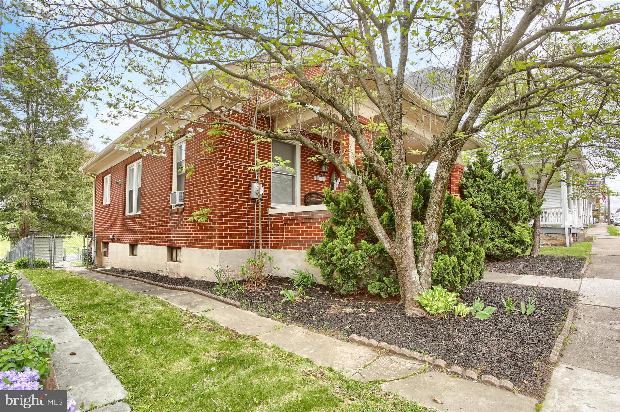 64 East Main Street Elizabethville, PA 17023 - Photo 29 of 29 a front view of a house with a yard and a garden