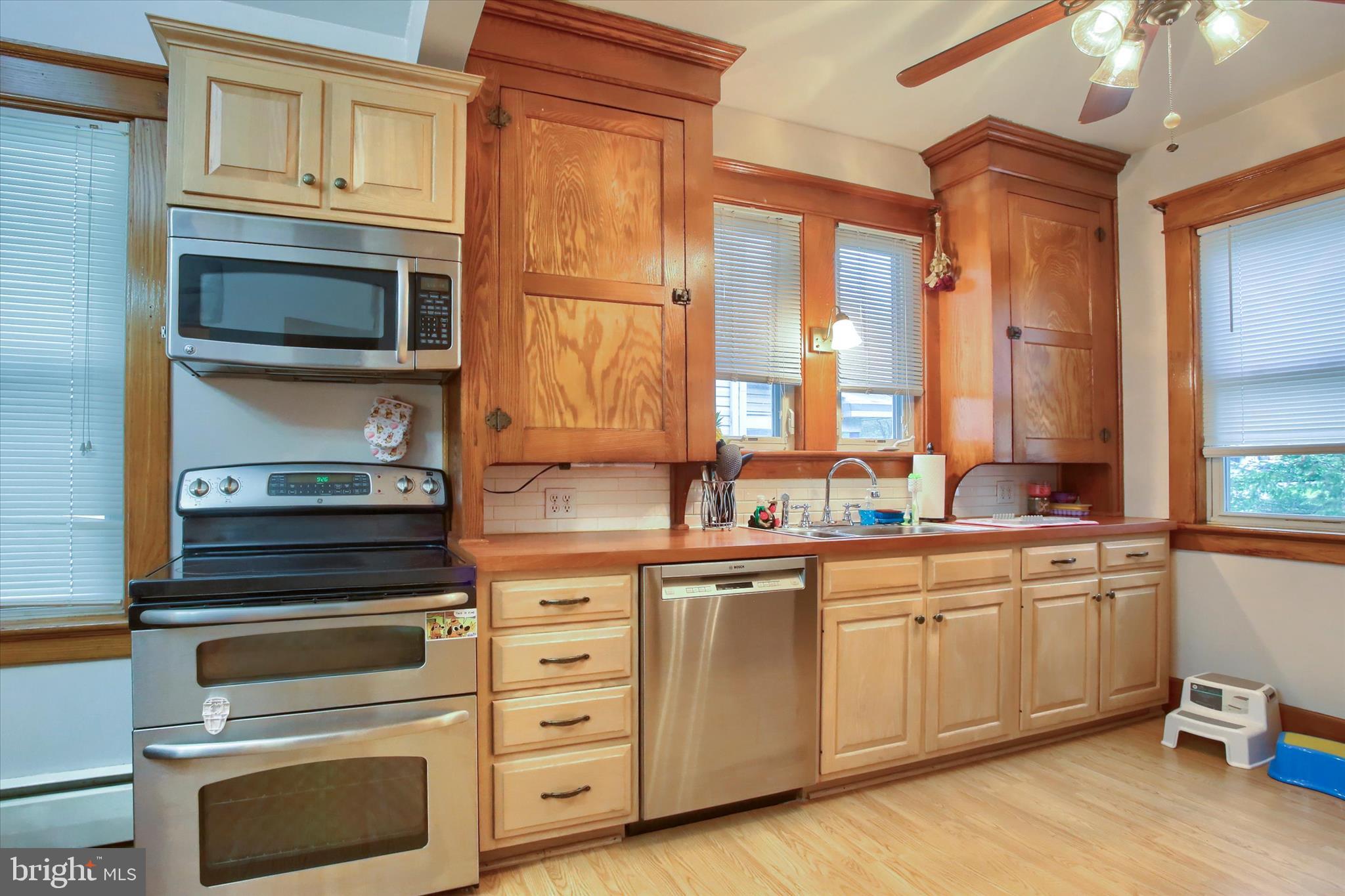 64 East Main Street Elizabethville, PA 17023 - Photo 7 of 29 a kitchen with cabinets stainless steel appliances and a sink