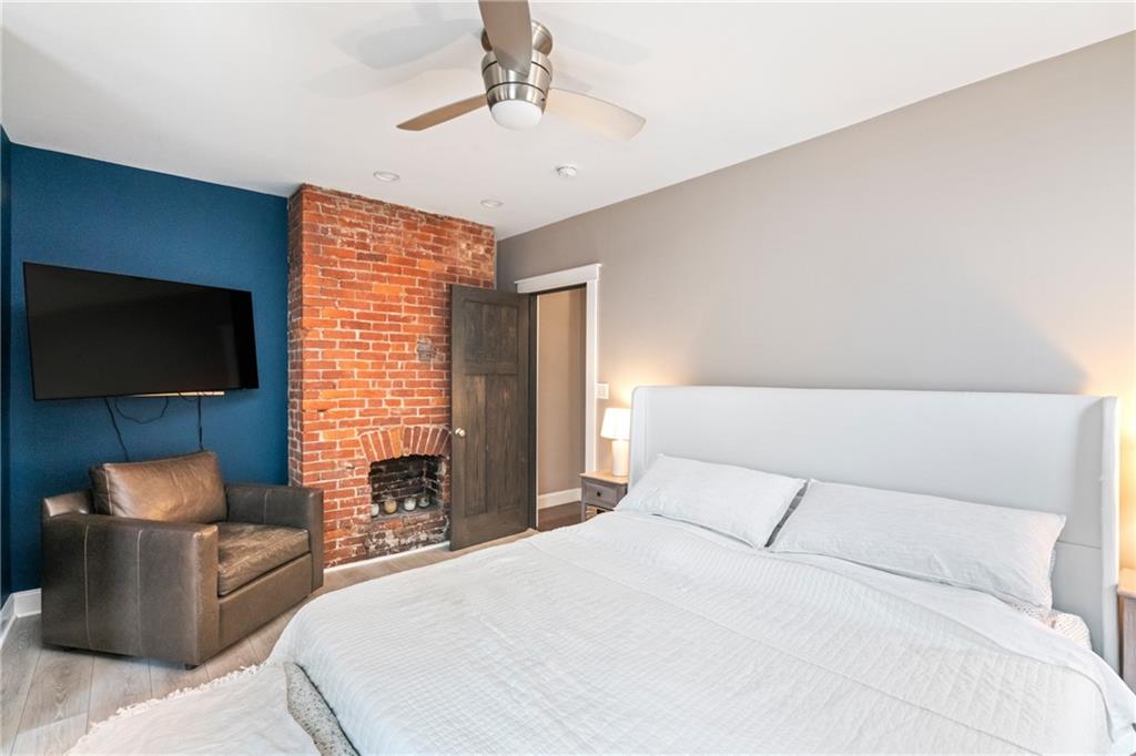 5208 Keystone Street Pittsburgh, PA 15201 - Photo 12 of 23 a bedroom with a bed and a flat screen tv