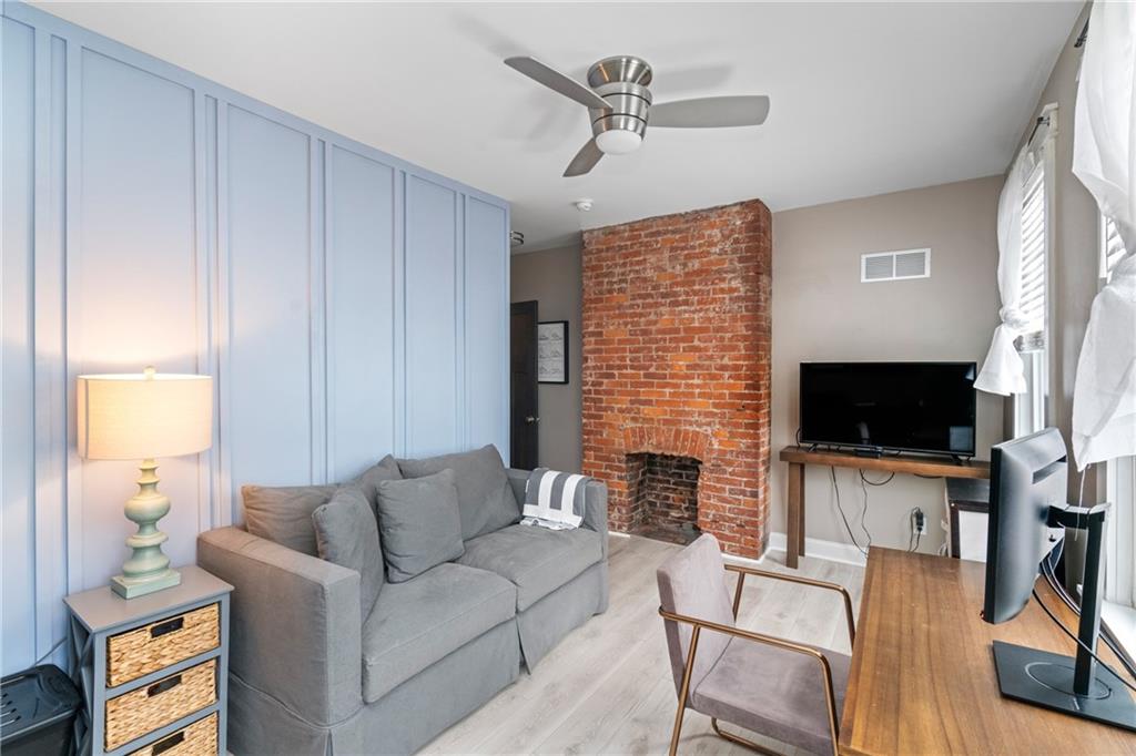 5208 Keystone Street Pittsburgh, PA 15201 - Photo 18 of 23 a living room with furniture a flat screen tv and a window