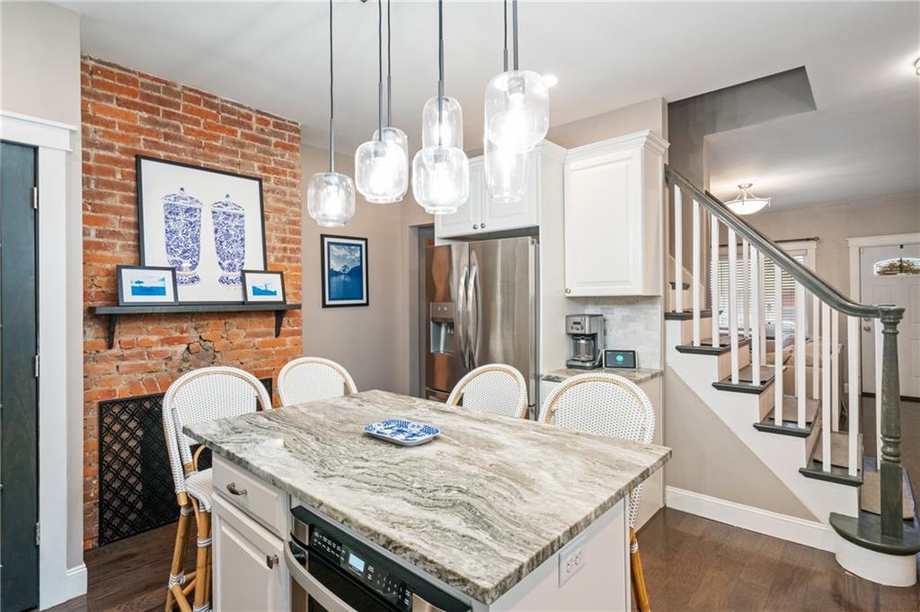 5208 Keystone Street Pittsburgh, PA 15201 - Photo 8 of 23 a view of a kitchen area with furniture and chandelier