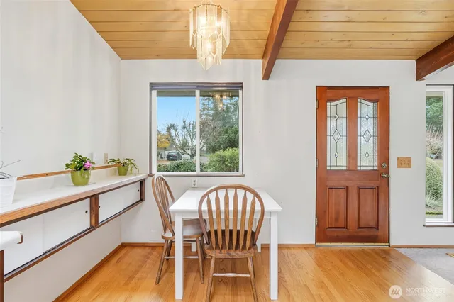 a view of a dining room with furniture window and outside view
