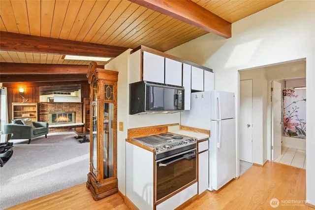 a kitchen with stainless steel appliances granite countertop a stove and a refrigerator
