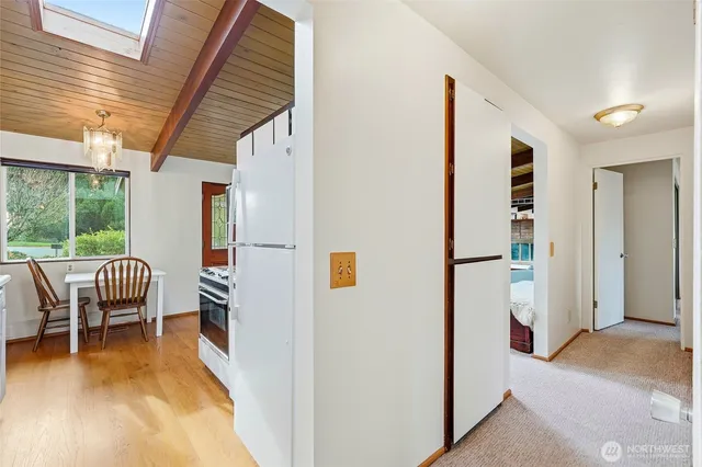 a view of a hallway with seating area