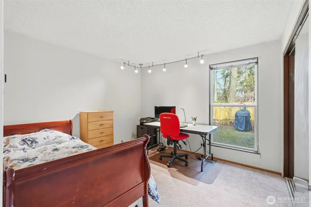 a living room with furniture and next to a window