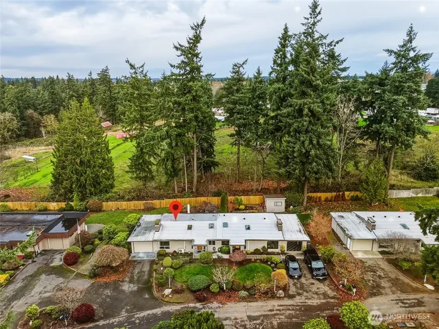 an aerial view of a house with yard swimming pool and outdoor seating