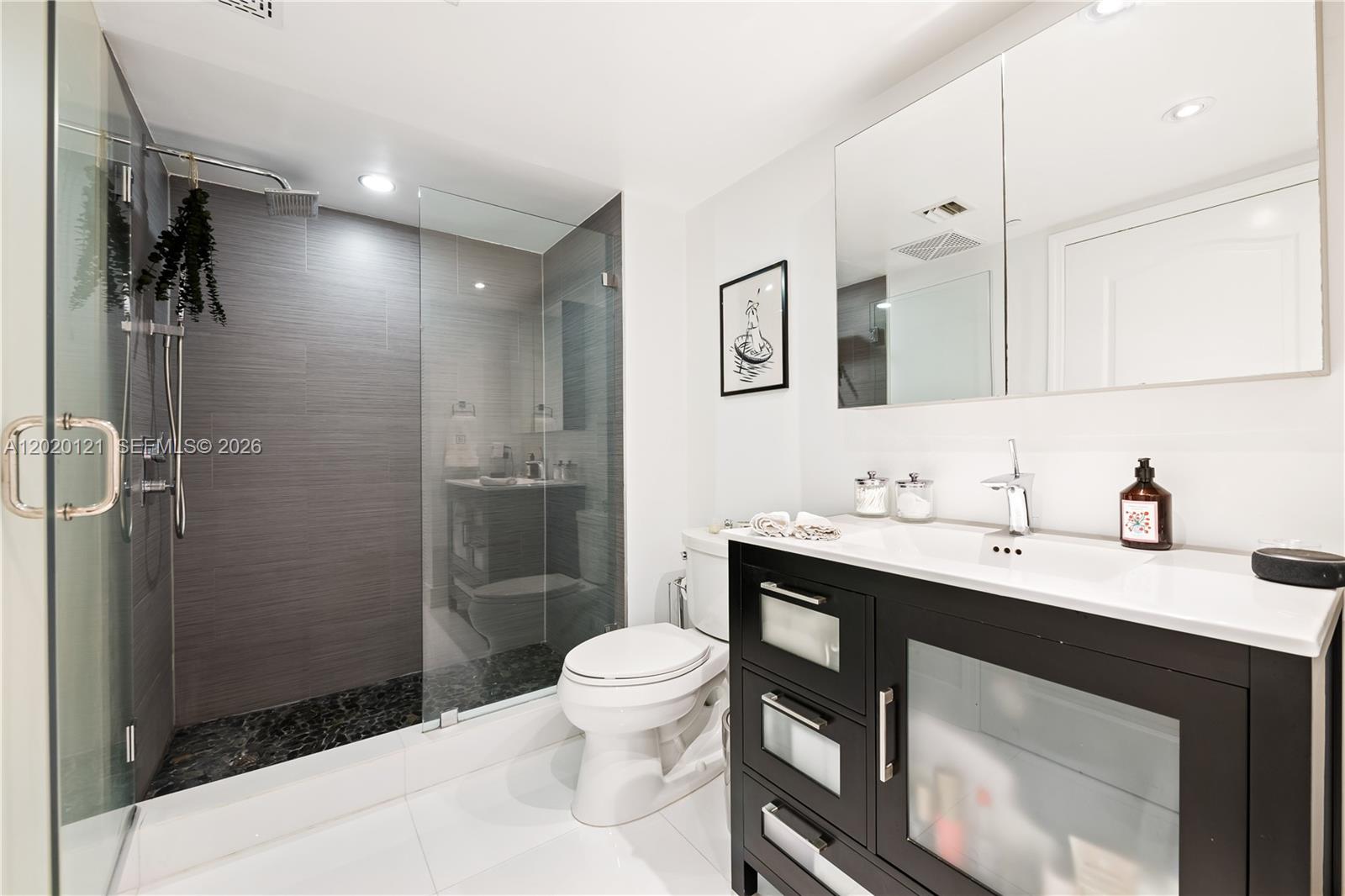 2101 Brickell Avenue, Unit 1909 Miami, FL 33129 - Photo 14 of 25 a bathroom with a sink toilet and shower