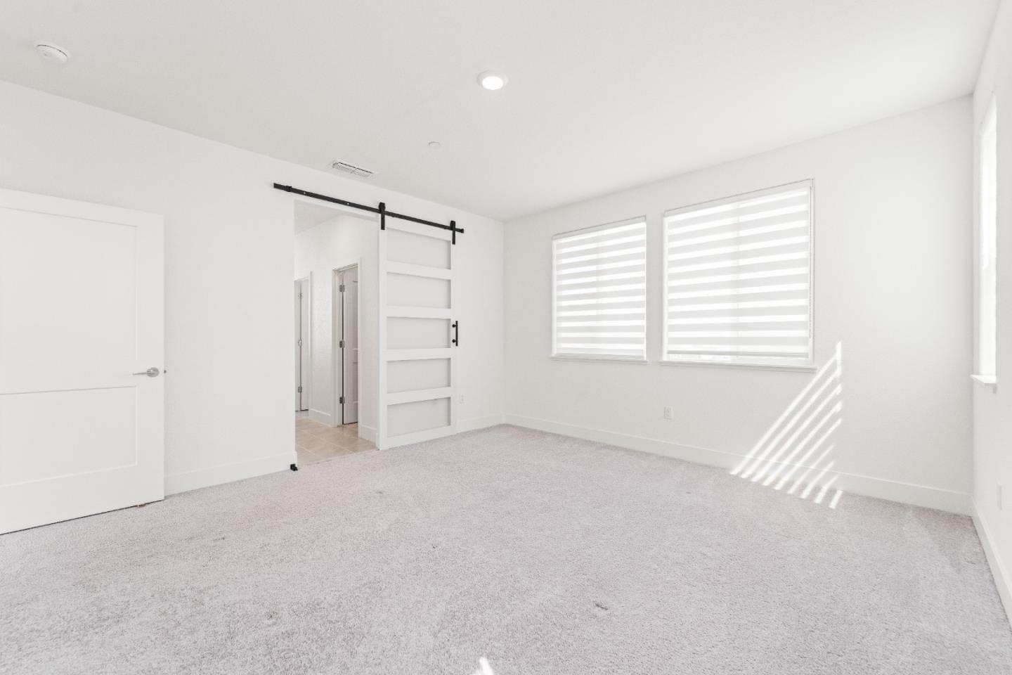 384 Ramos Ranch Road Oakley, CA 94561 - Photo 20 of 39 an empty room with windows