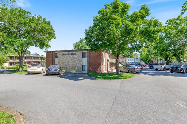 a view of street with parked cars