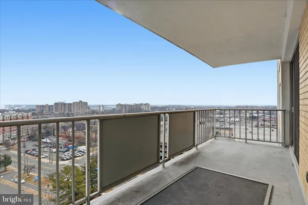 a view of a balcony with city