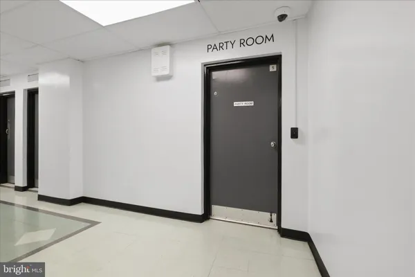 a view of a swimming pool with a patio and a yard