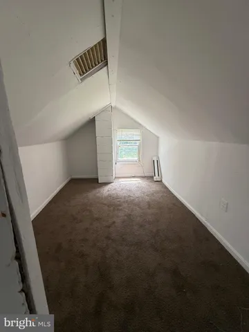 a view of empty room with windows