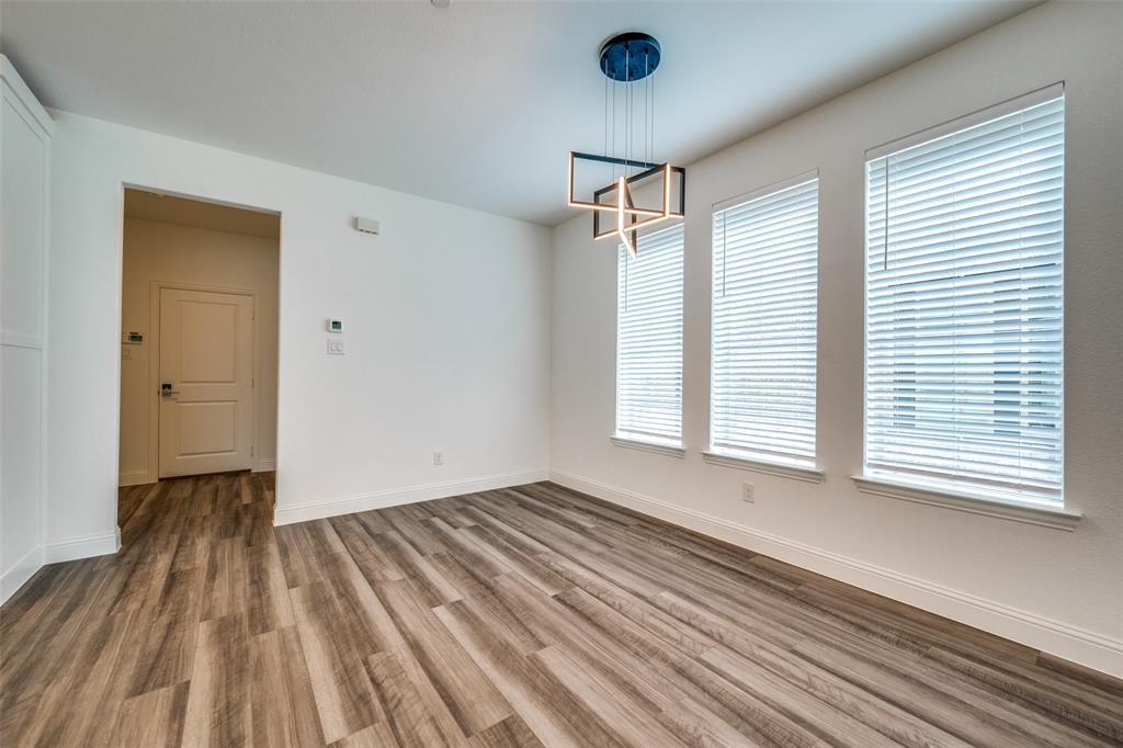 7336 Panicum Drive Frisco, TX 75033 - Photo 11 of 25 wooden floor in an empty room with a window