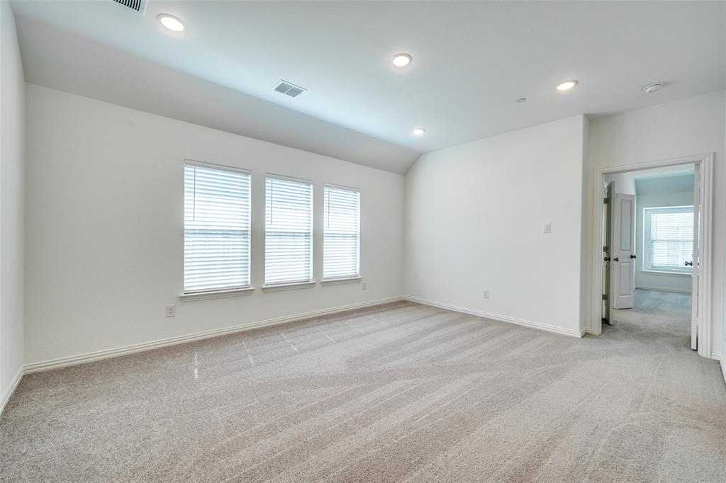 7336 Panicum Drive Frisco, TX 75033 - Photo 16 of 25 an empty room with windows and entrance