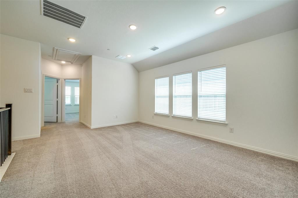 7336 Panicum Drive Frisco, TX 75033 - Photo 19 of 25 an empty room with windows and closet
