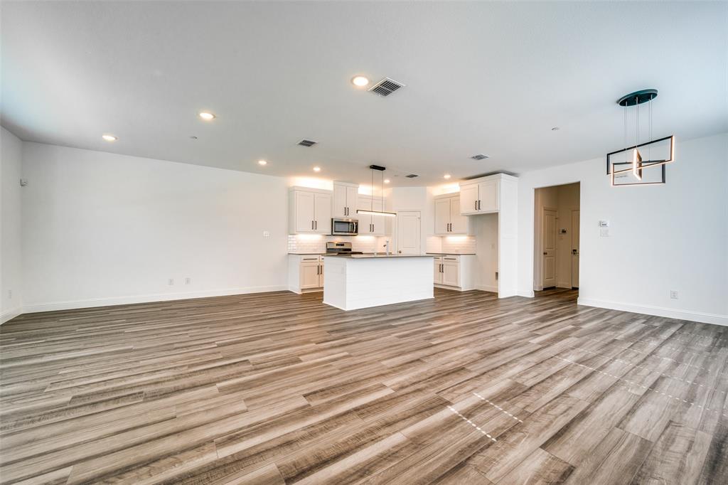 7336 Panicum Drive Frisco, TX 75033 - Photo 2 of 25 a view of kitchen view with wooden floor