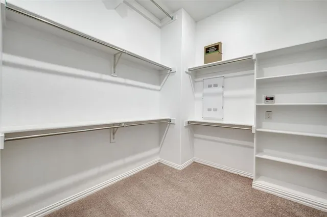 a view of a kitchen with white cabinets