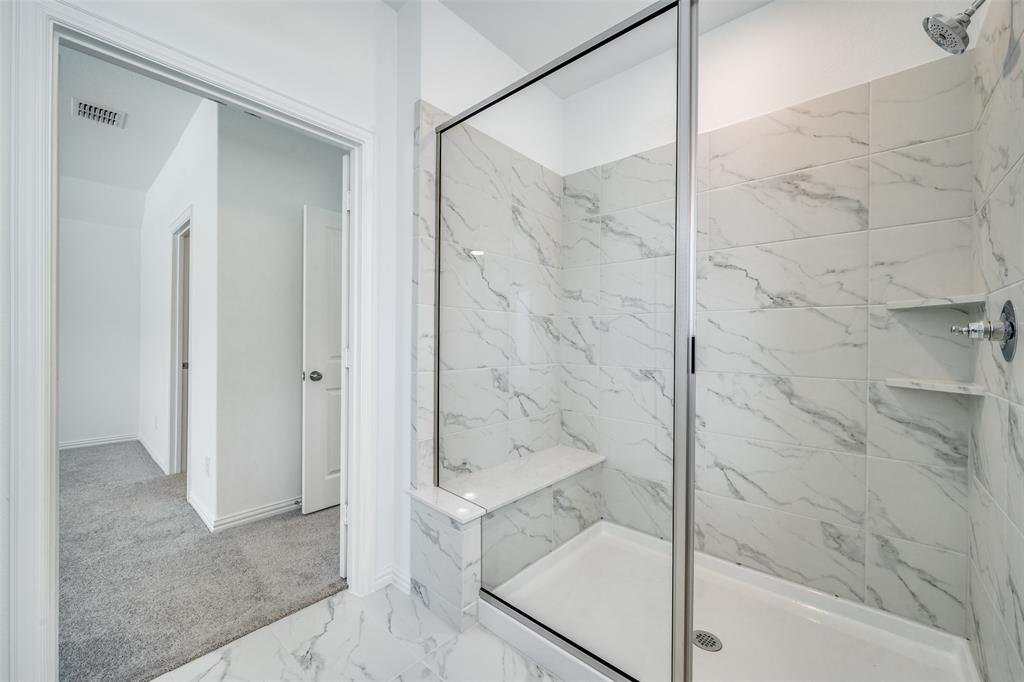 7336 Panicum Drive Frisco, TX 75033 - Photo 25 of 25 a bathroom with a bathtub and shower