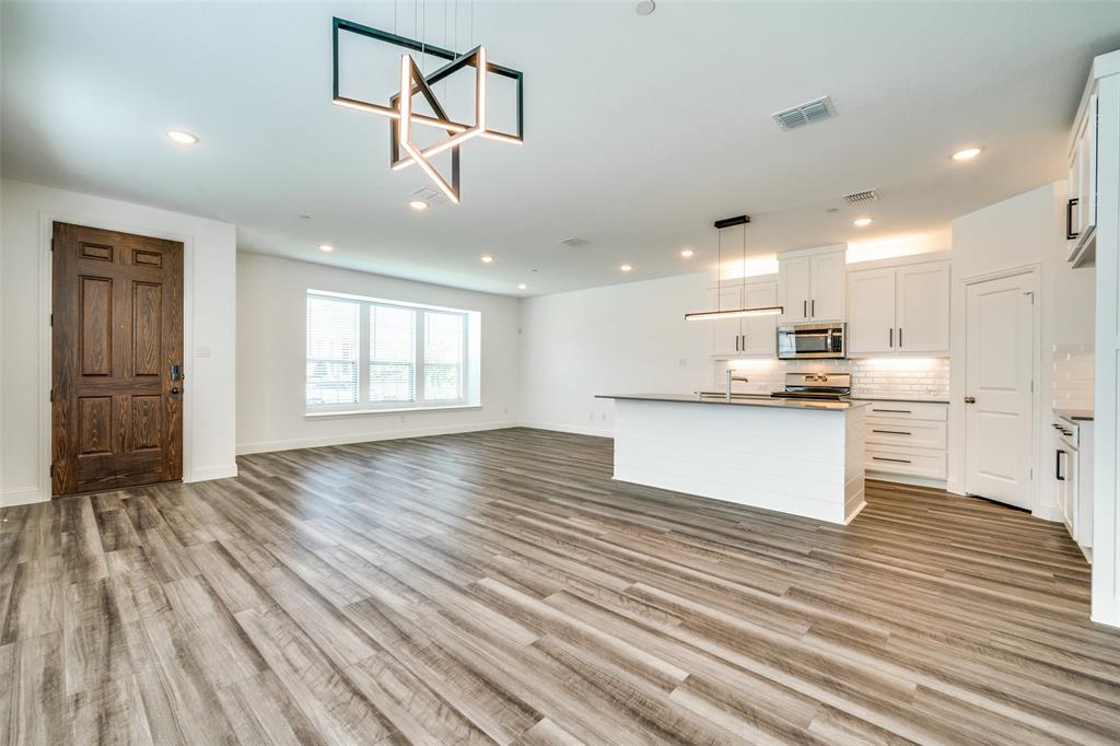 7336 Panicum Drive Frisco, TX 75033 - Photo 6 of 25 a view of kitchen and kitchen with wooden floor