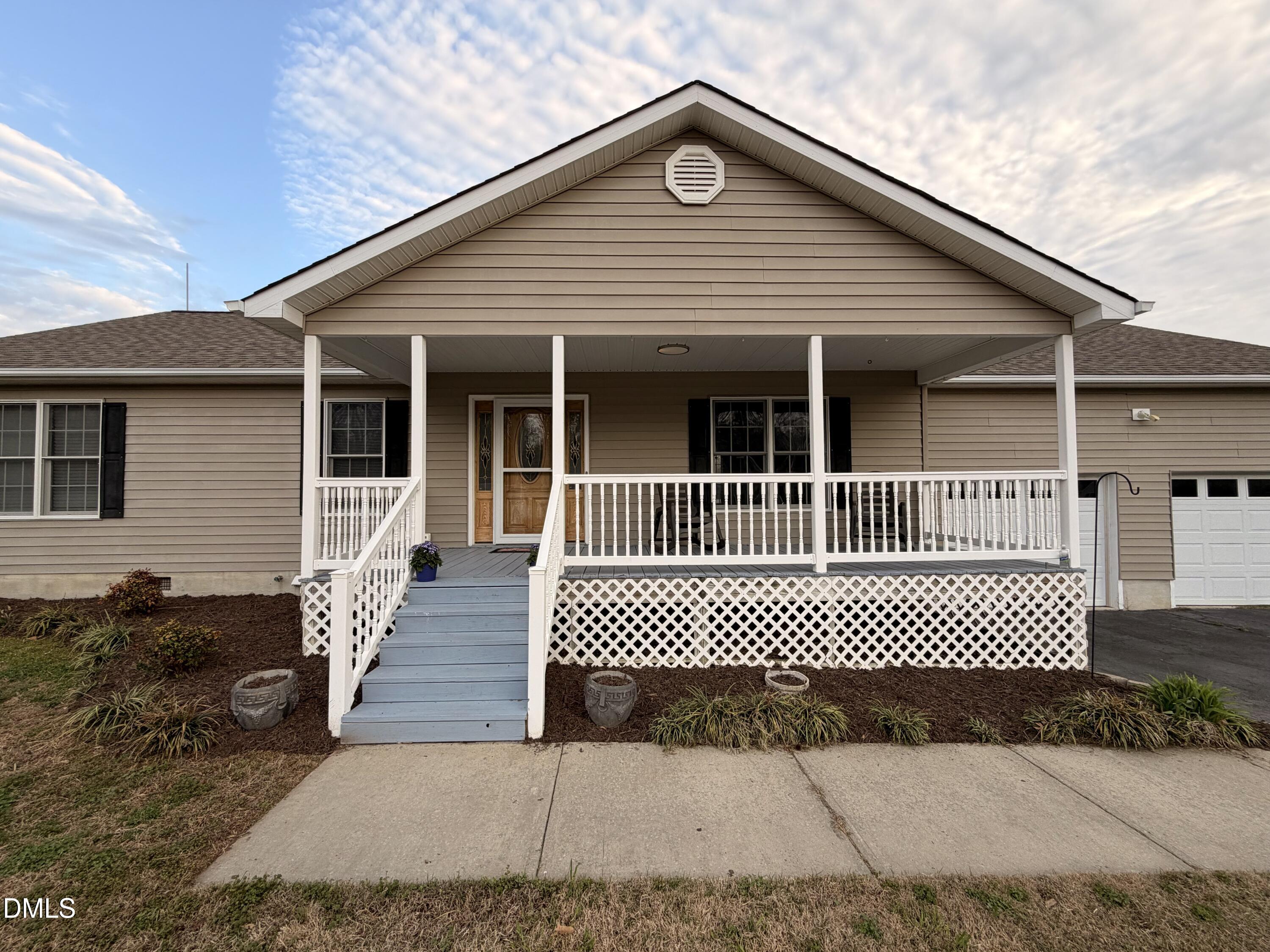 111 Fox Crossing Drive Roxboro, NC 27574 - Photo 2 of 25 a front view of a house with a deck