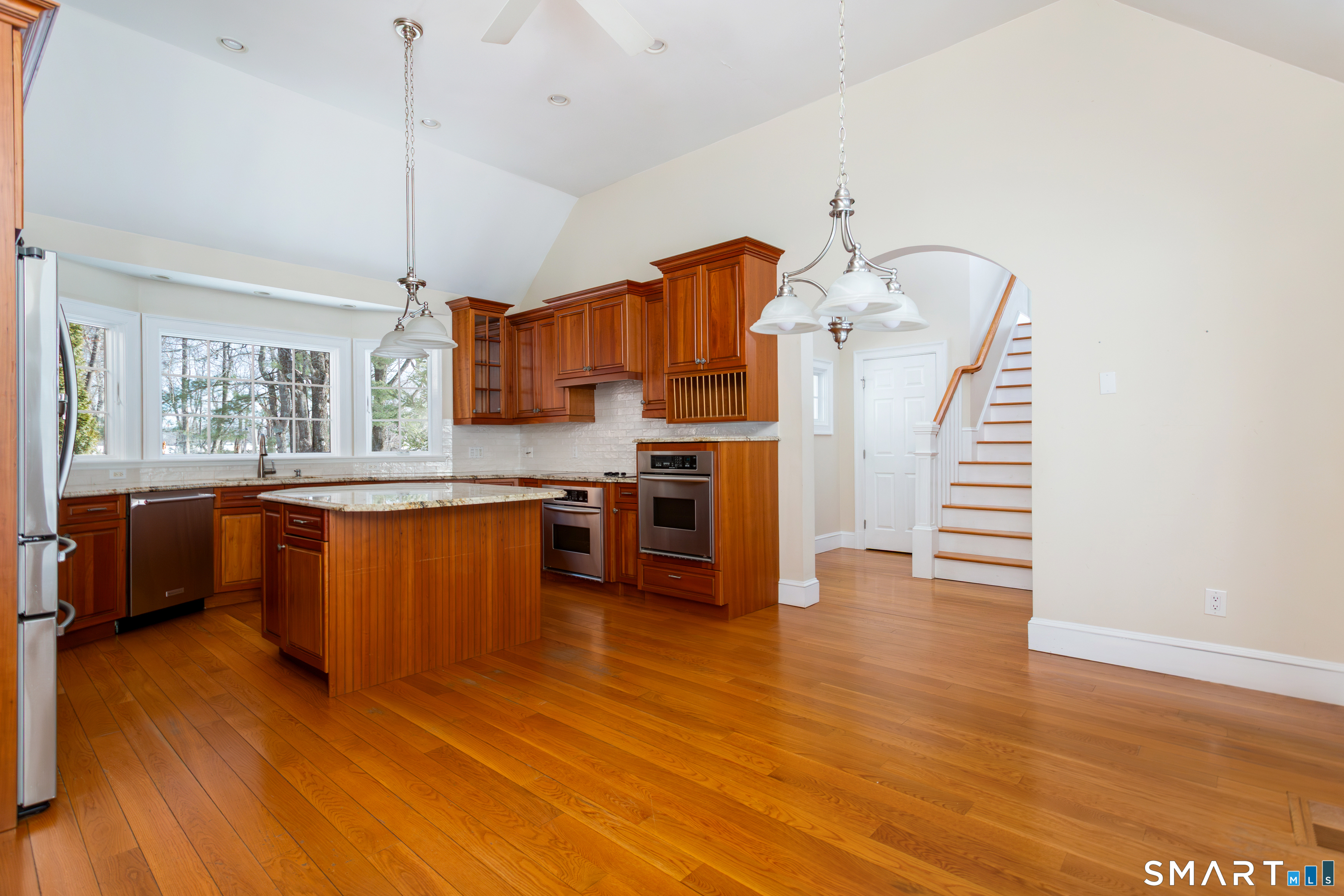 51 Wilson Road Easton, CT 06612 - Photo 11 of 41 a kitchen with stainless steel appliances wooden floor sink and wooden floor