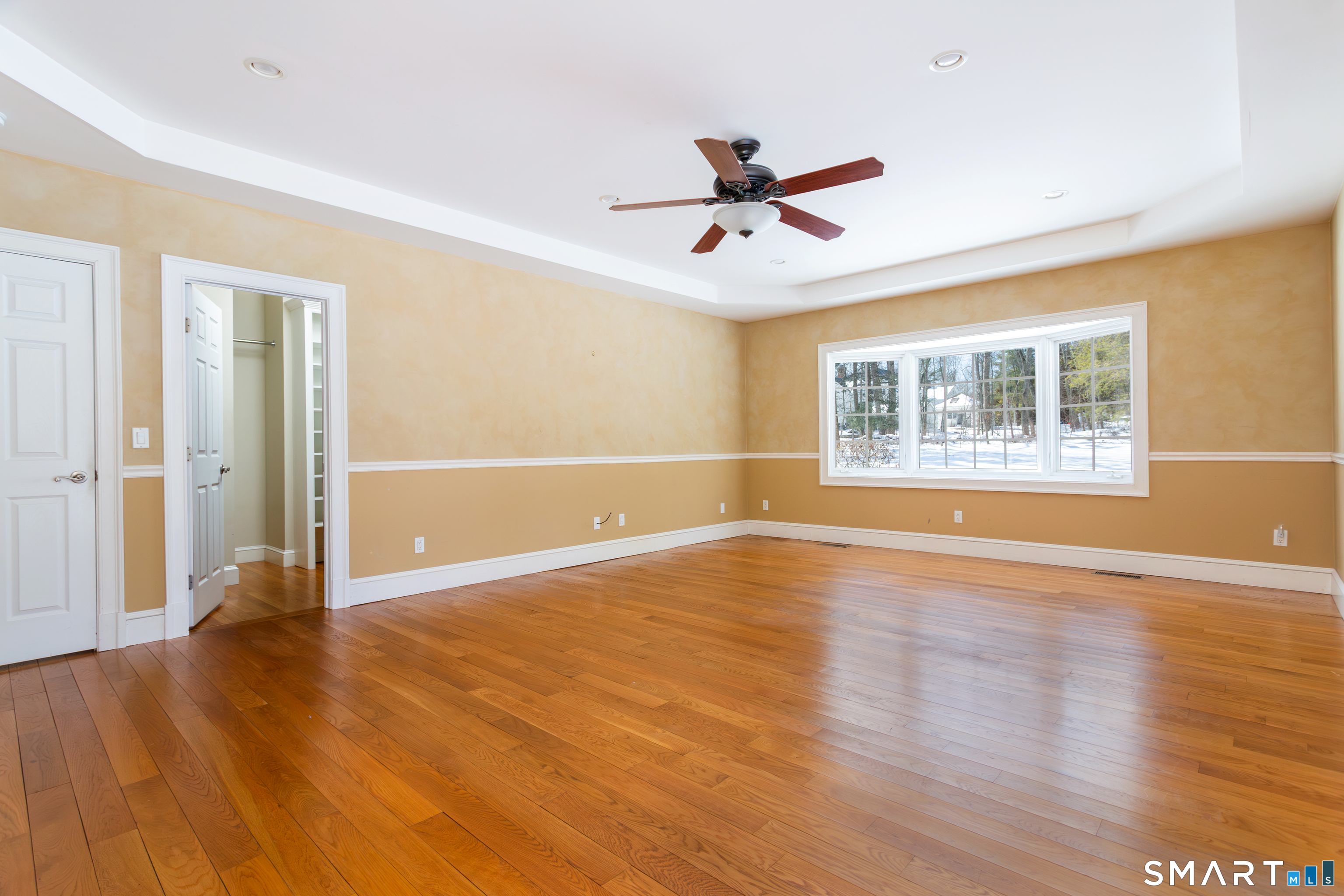 51 Wilson Road Easton, CT 06612 - Photo 14 of 41 a view of an empty room with wooden floor and a window