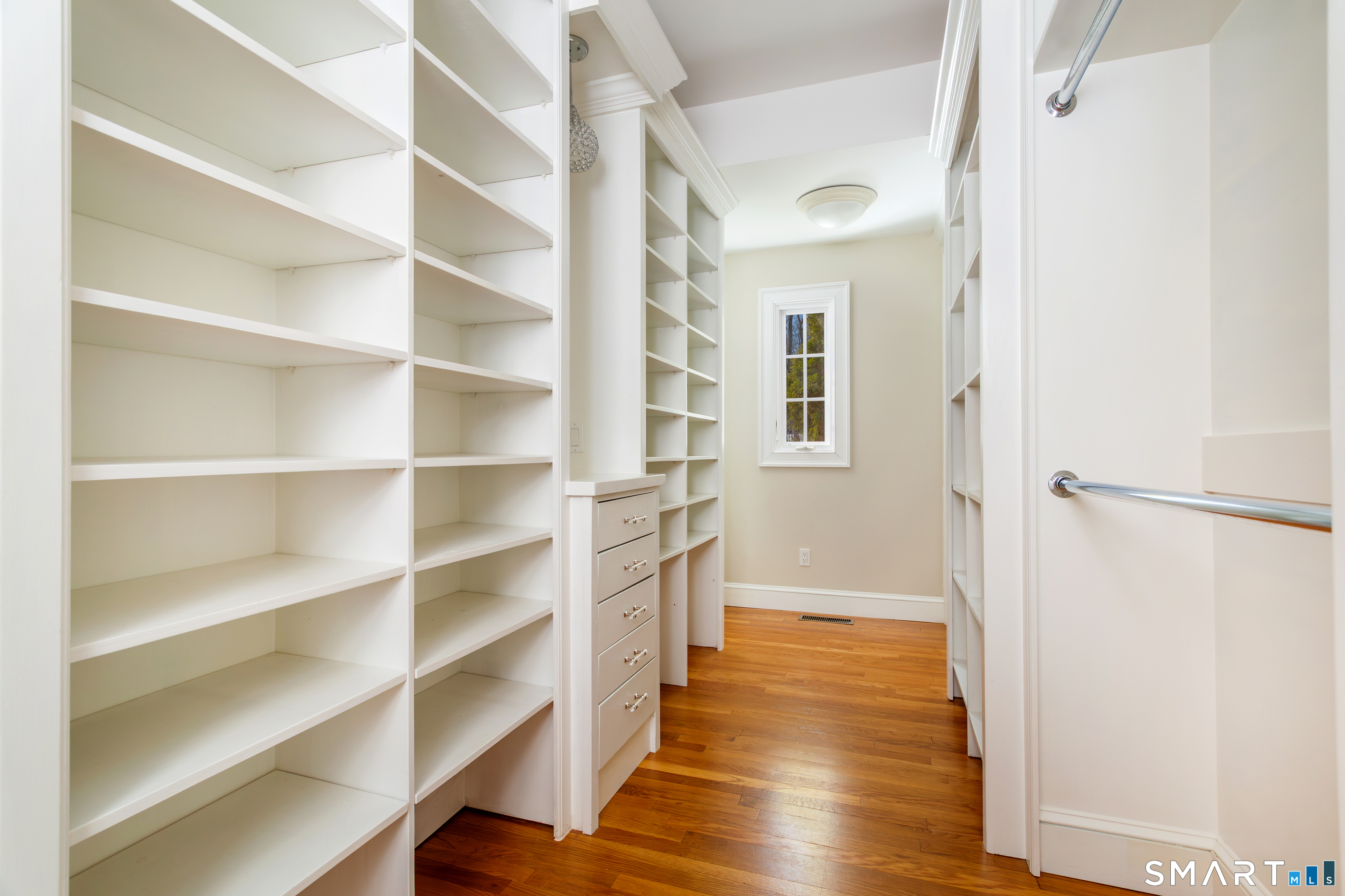 51 Wilson Road Easton, CT 06612 - Photo 15 of 41 a view of a hallway with wooden floor and staircase