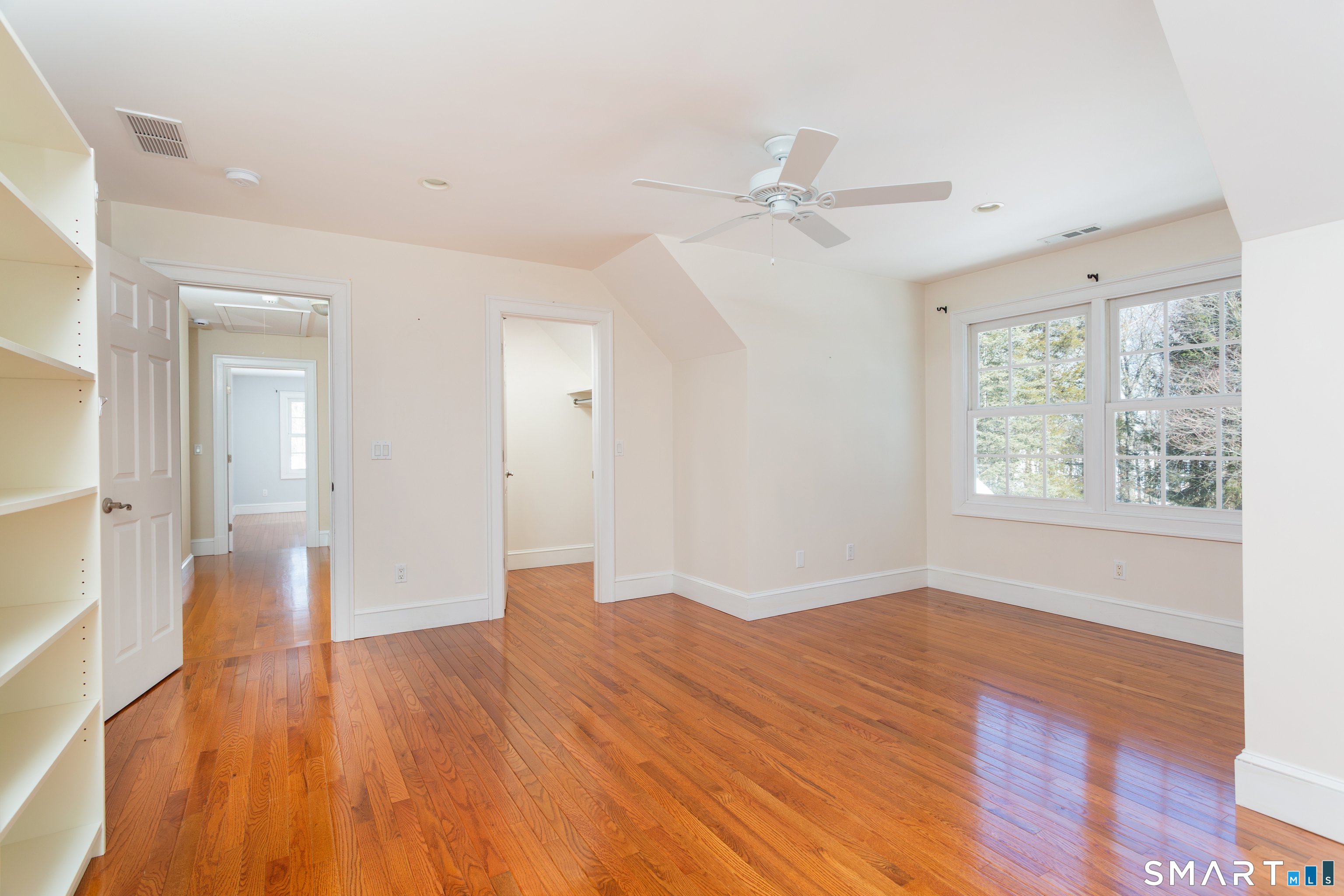 51 Wilson Road Easton, CT 06612 - Photo 19 of 41 a view of an empty room with wooden floor and a window