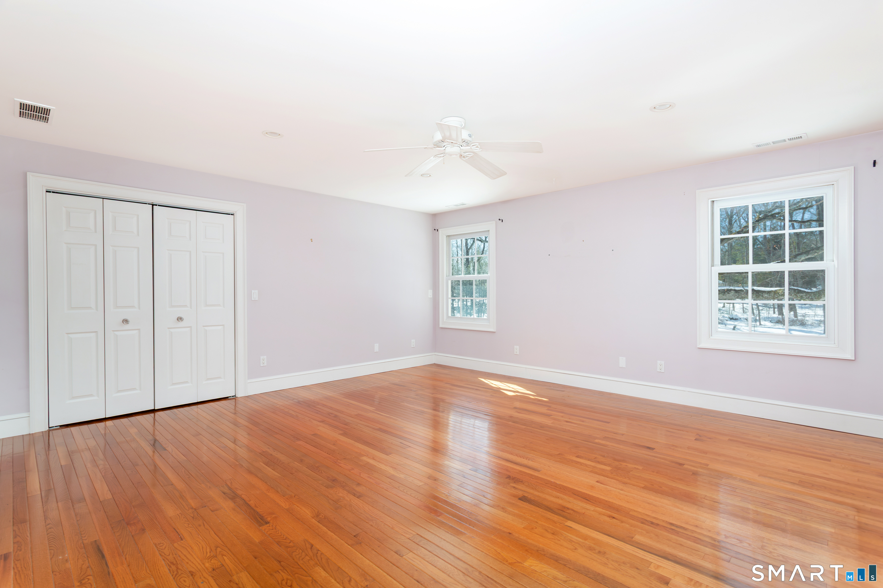 51 Wilson Road Easton, CT 06612 - Photo 20 of 41 a view of an empty room with wooden floor and a window