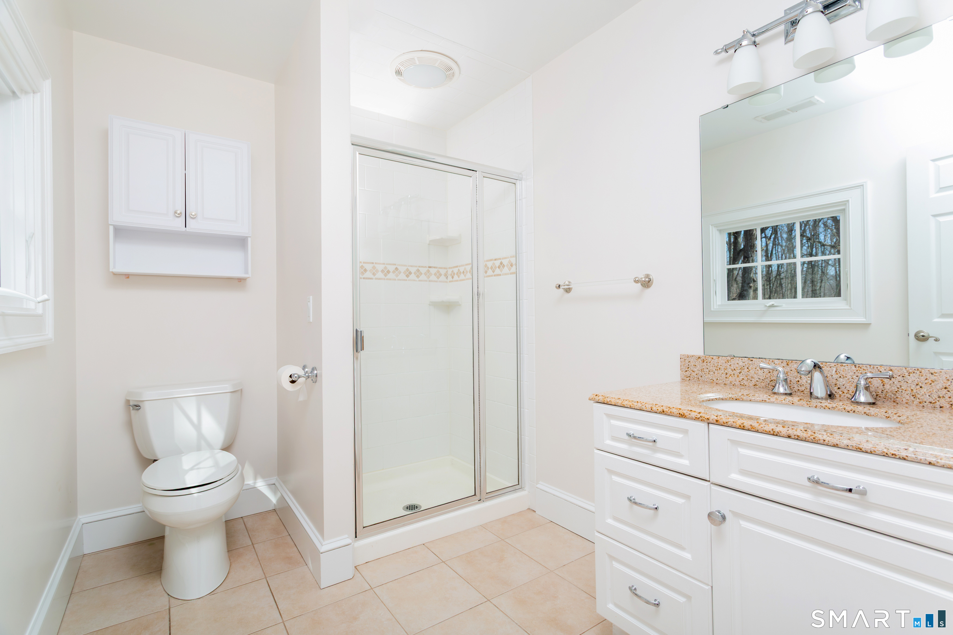 51 Wilson Road Easton, CT 06612 - Photo 21 of 41 a spacious bathroom with a toilet sink and mirror