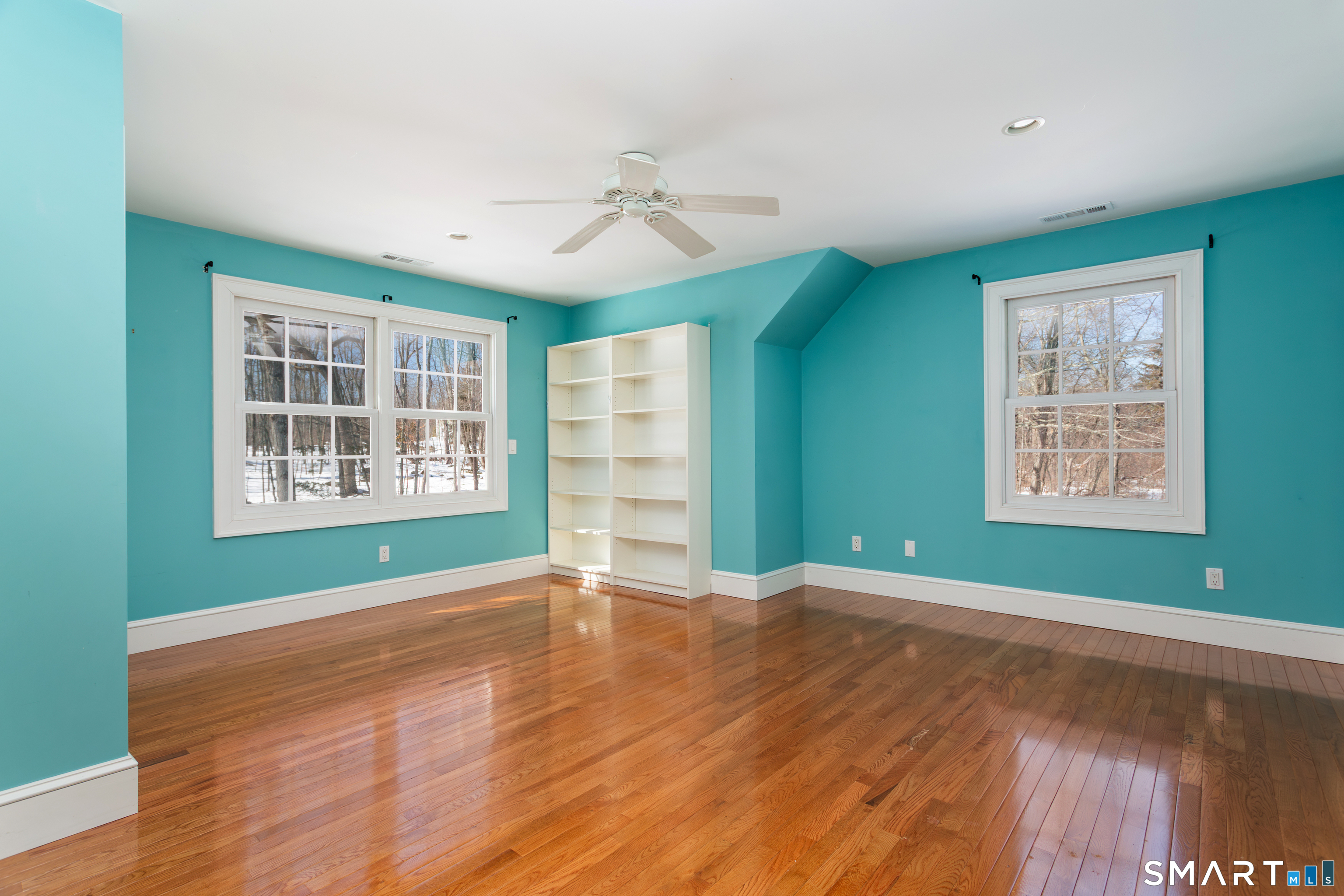 51 Wilson Road Easton, CT 06612 - Photo 22 of 41 a view of an empty room with window and wooden floor