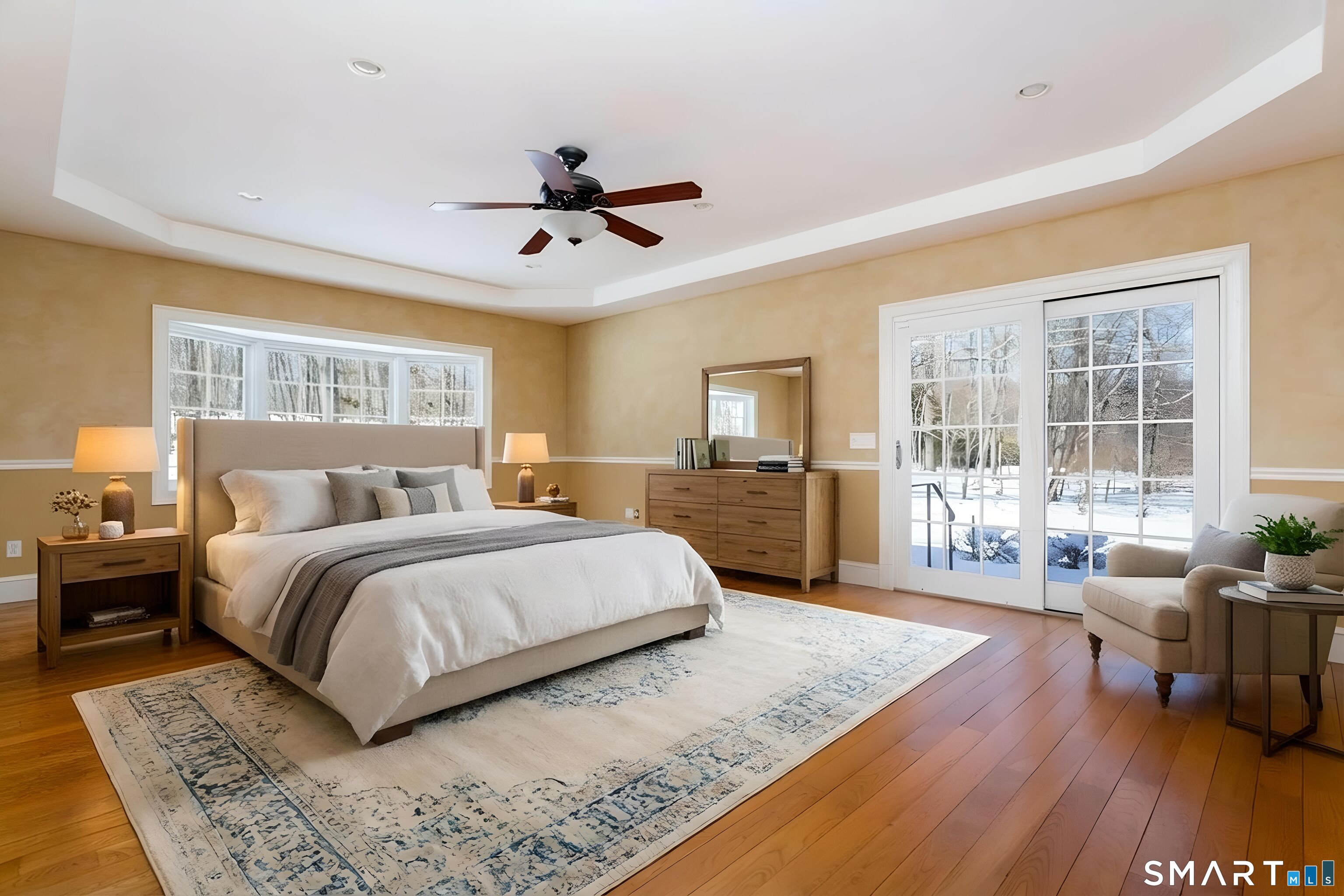 51 Wilson Road Easton, CT 06612 - Photo 26 of 41 a spacious bedroom with a large bed and a wooden floor