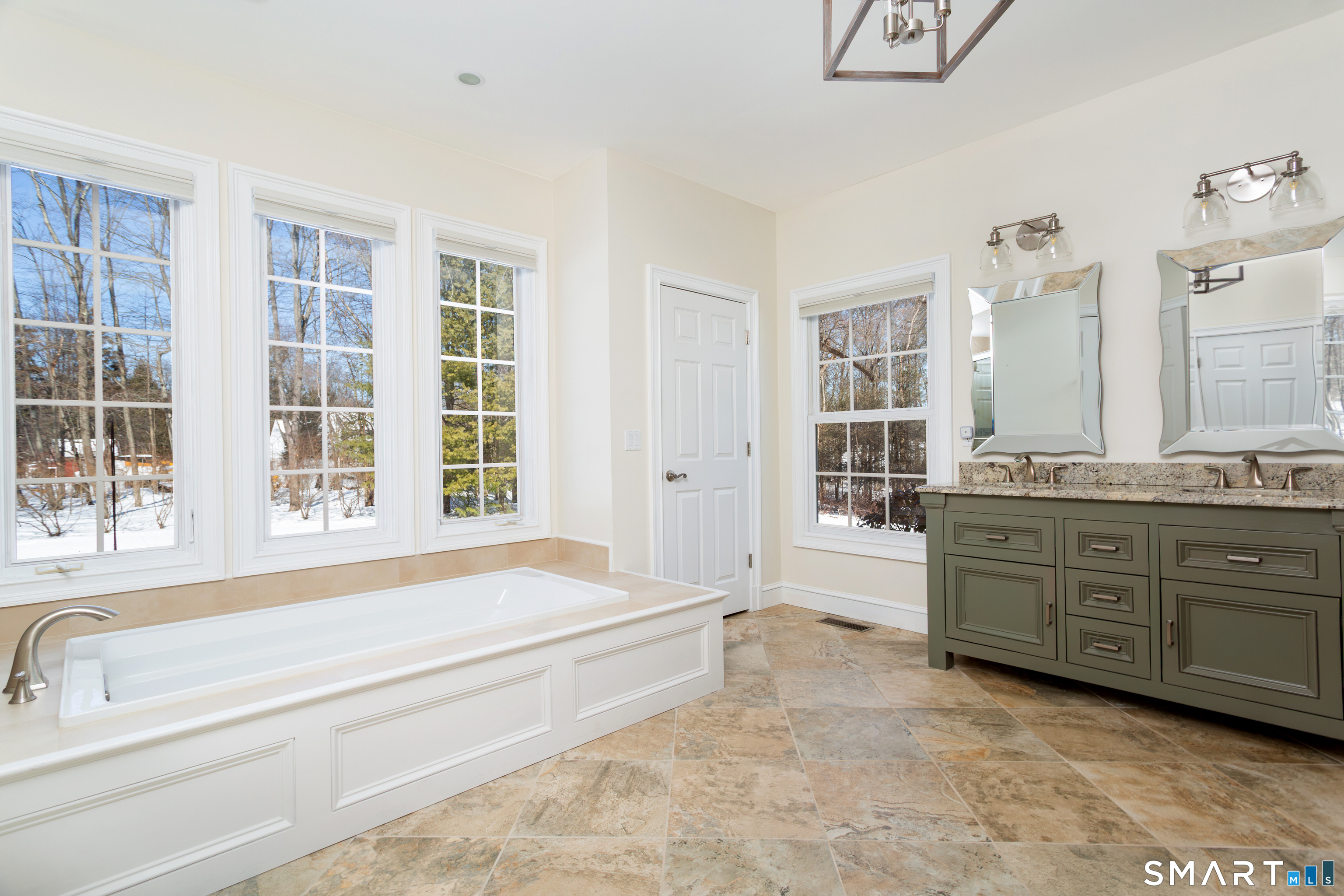 51 Wilson Road Easton, CT 06612 - Photo 27 of 41 a spacious bathroom with a tub sink and mirror