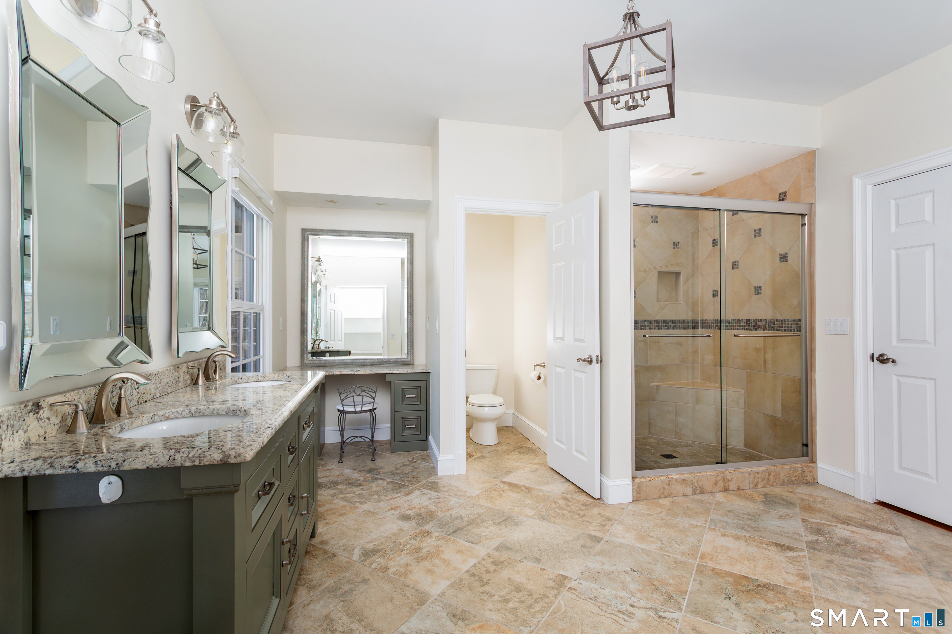 51 Wilson Road Easton, CT 06612 - Photo 28 of 41 a spacious bathroom with a granite countertop sink a mirror and shower