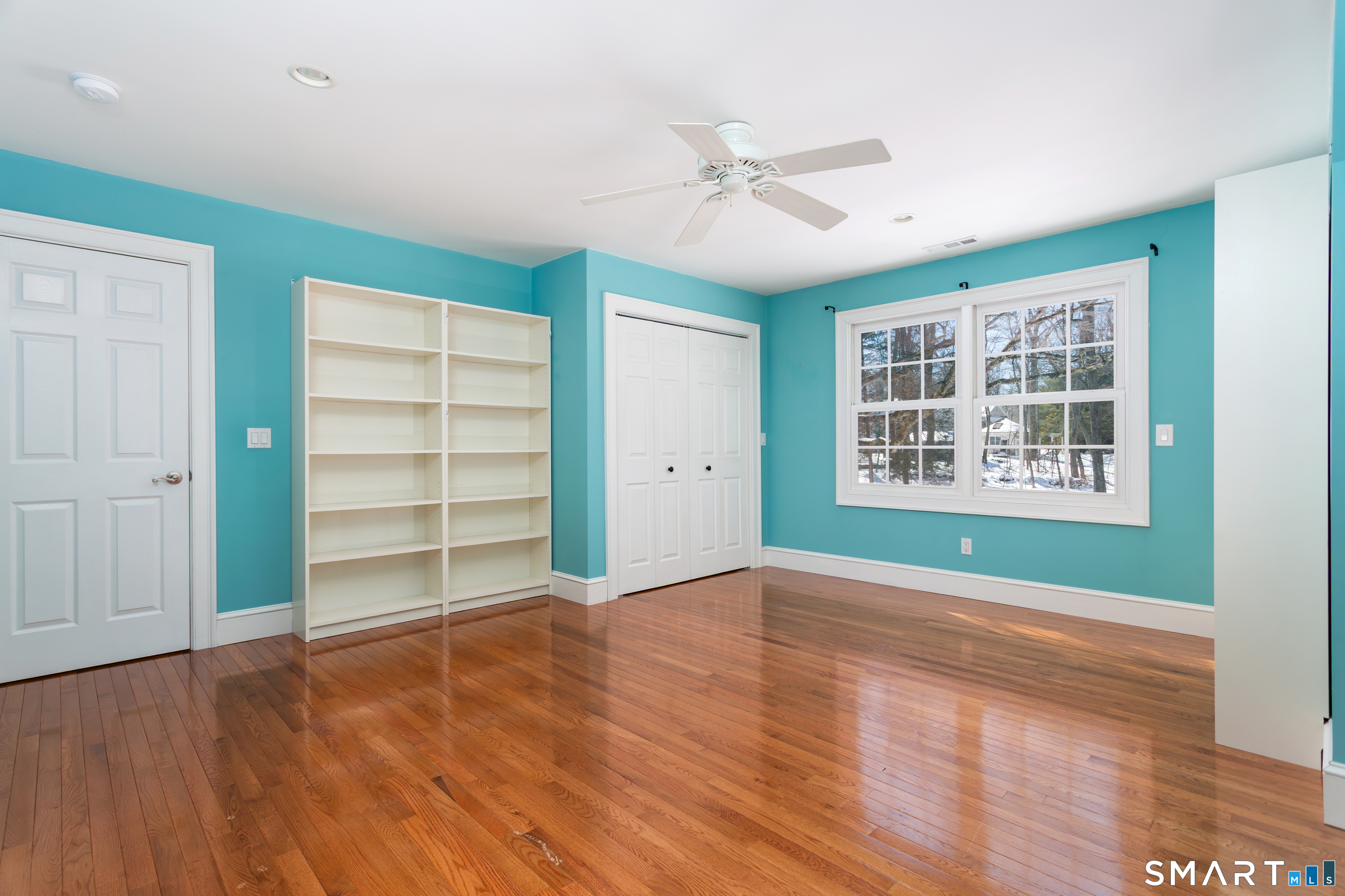 51 Wilson Road Easton, CT 06612 - Photo 29 of 41 a view of an empty room with a window and wooden floor