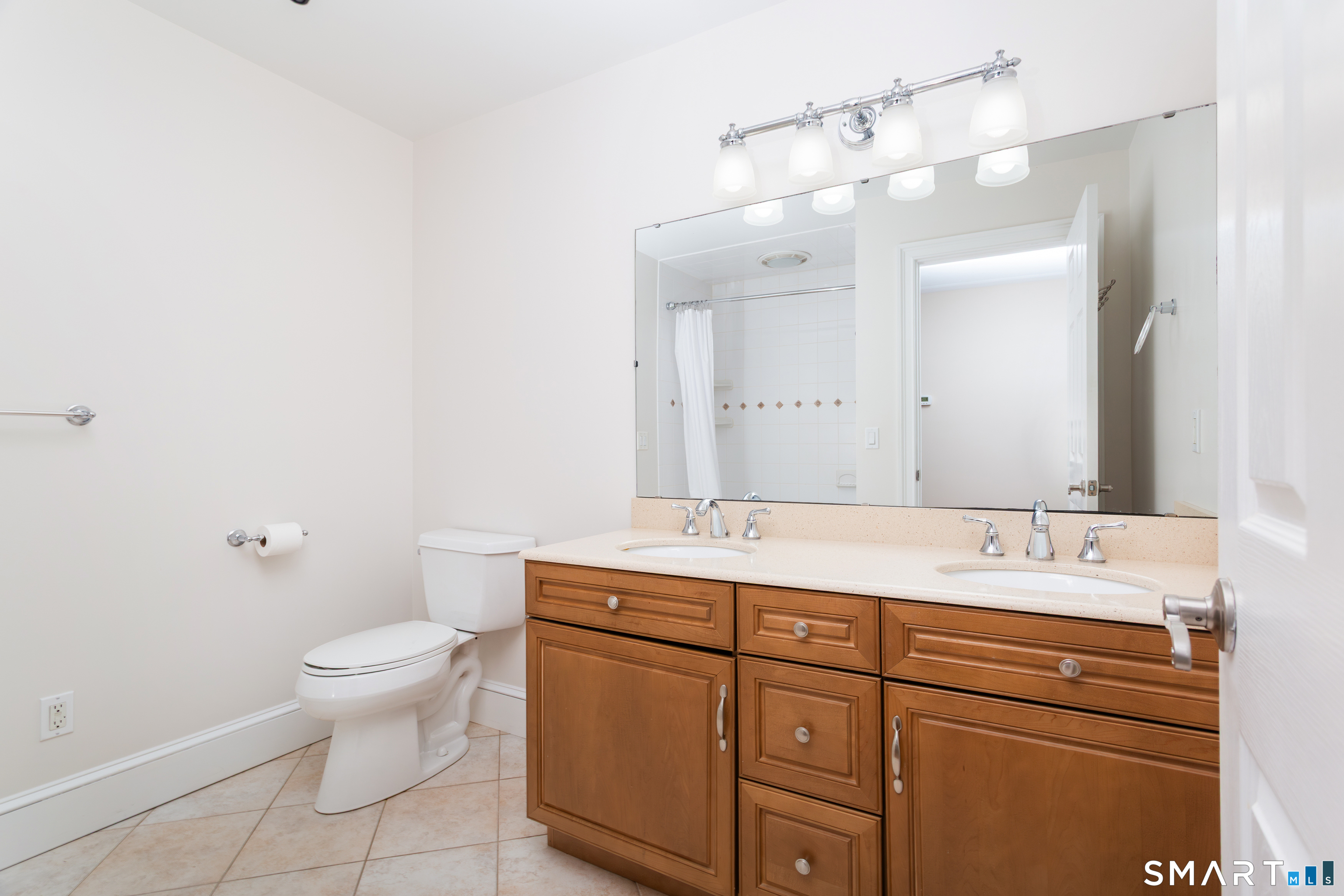 51 Wilson Road Easton, CT 06612 - Photo 30 of 41 a spacious bathroom with a granite countertop sink a toilet and a mirror