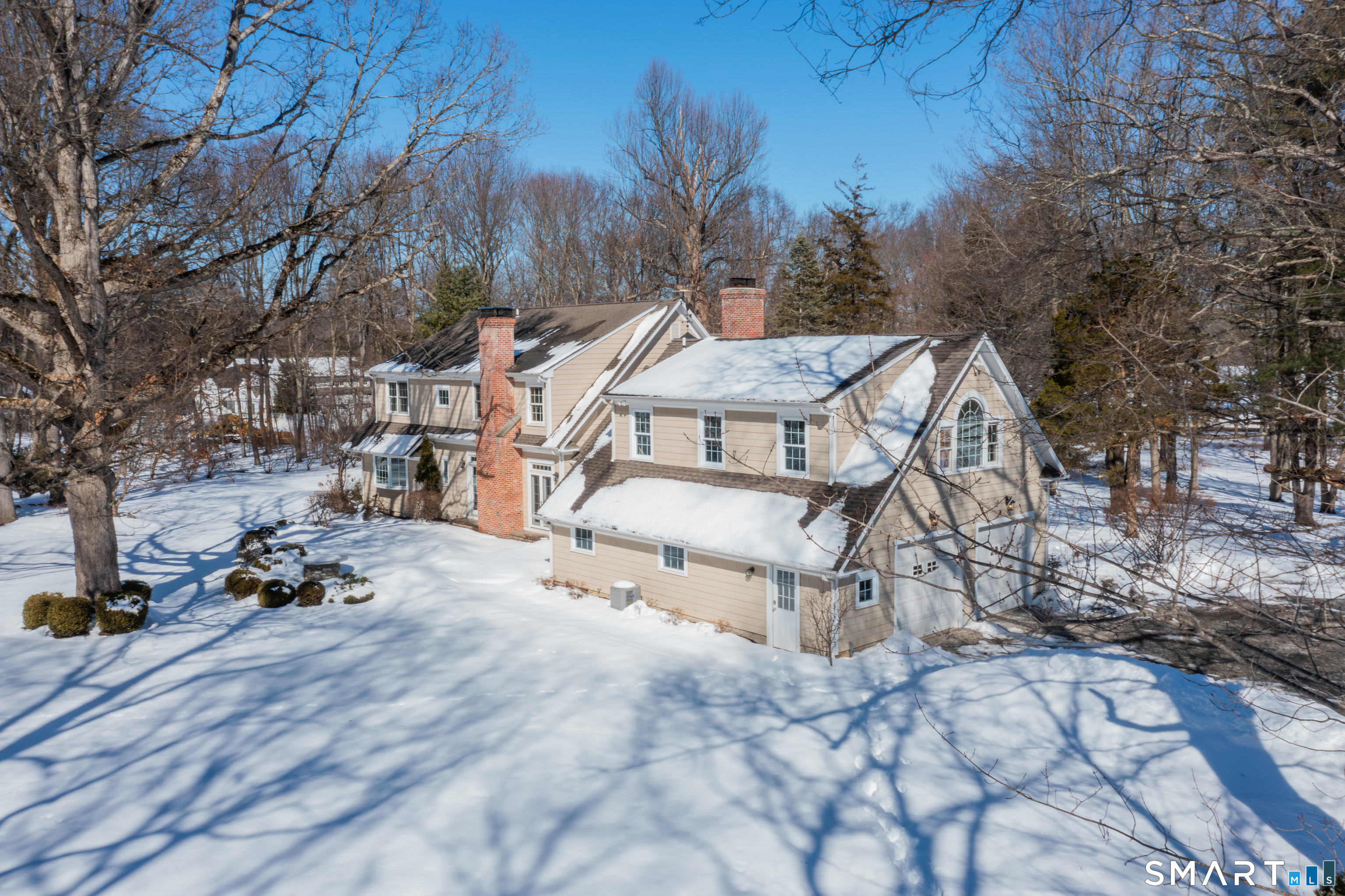 51 Wilson Road Easton, CT 06612 - Photo 41 of 41 a view of a house with a yard covered in snow