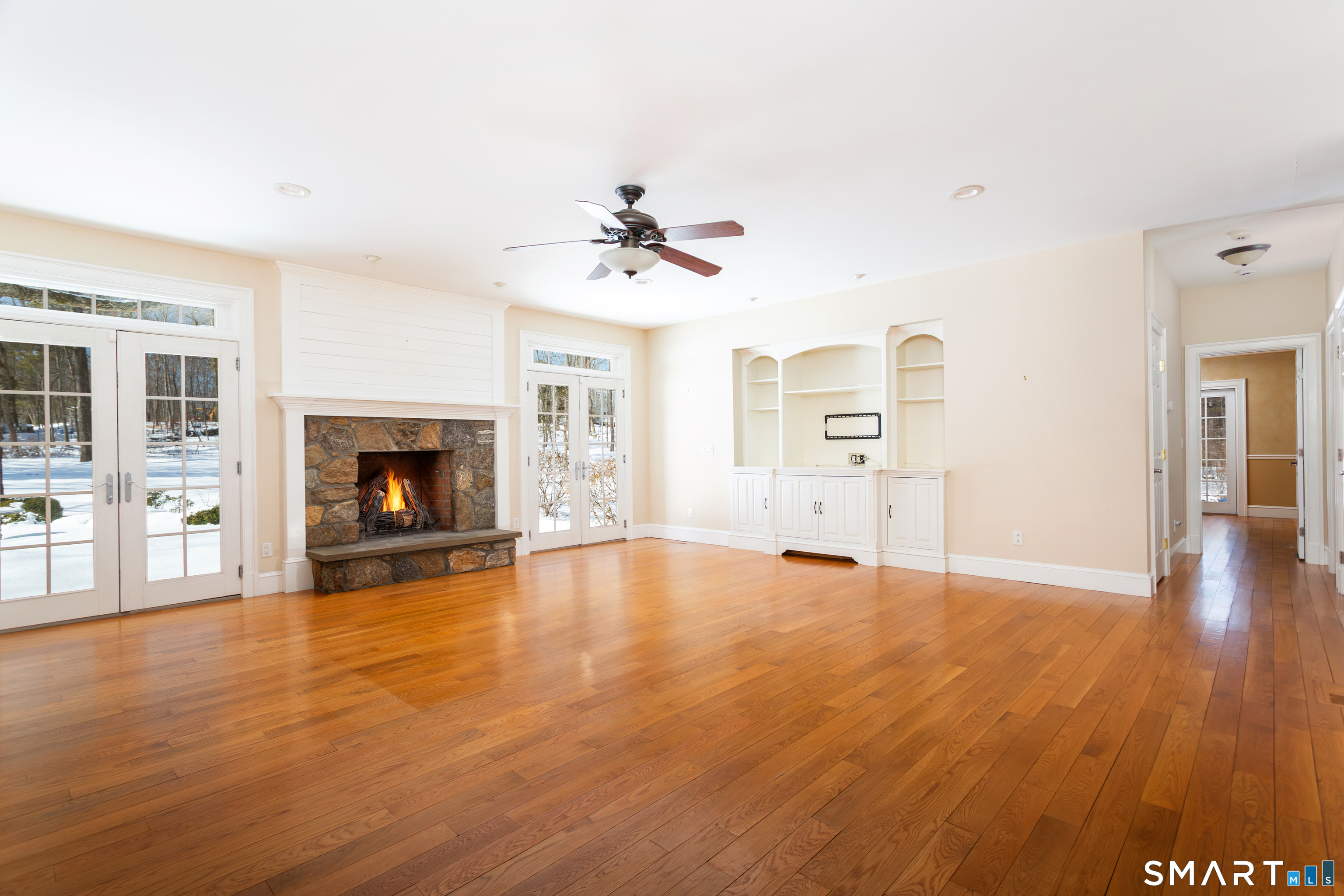 51 Wilson Road Easton, CT 06612 - Photo 5 of 41 an empty room with windows and fireplace