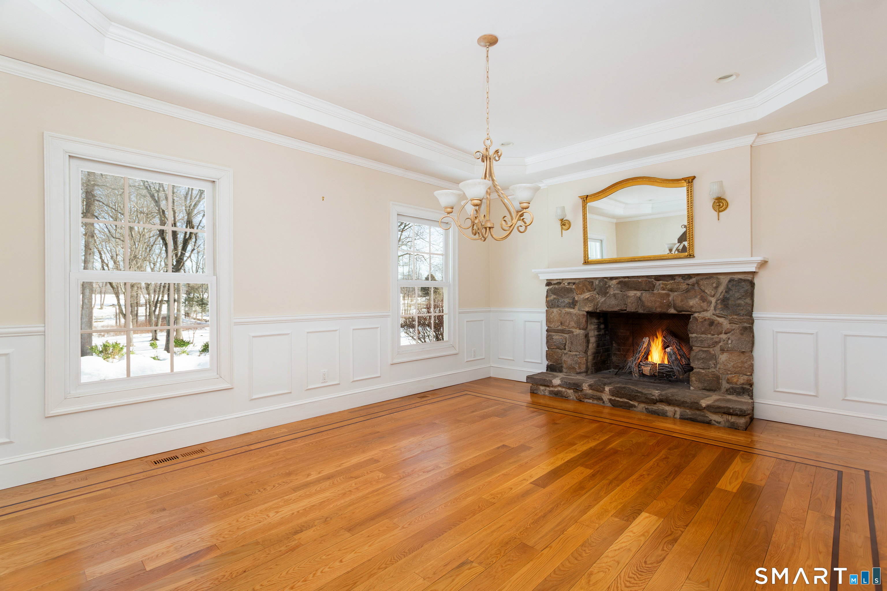 51 Wilson Road Easton, CT 06612 - Photo 8 of 41 a view of an empty room with wooden floor fireplace and a window
