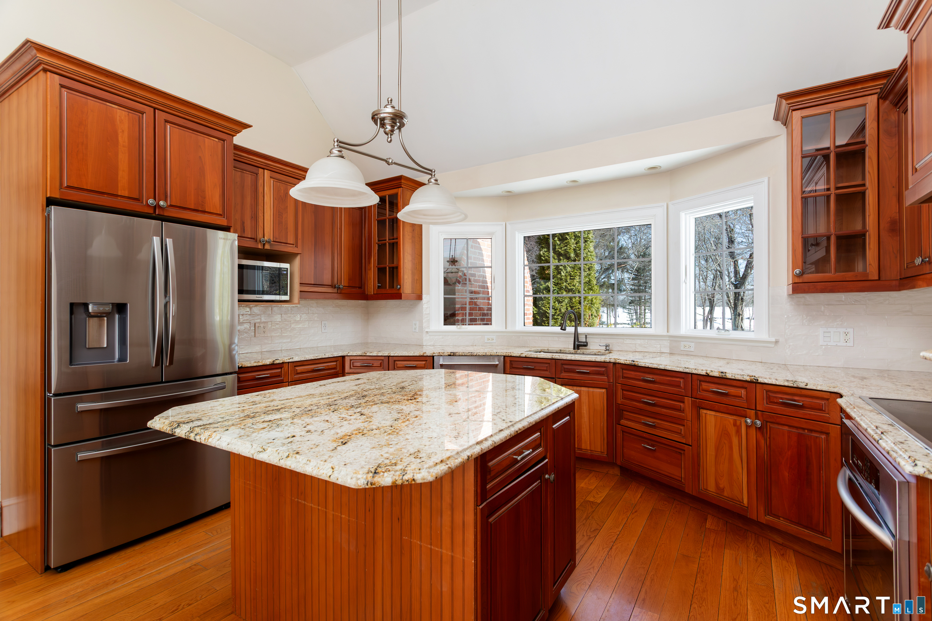 51 Wilson Road Easton, CT 06612 - Photo 9 of 41 a kitchen with stainless steel appliances granite countertop a sink a stove and a refrigerator