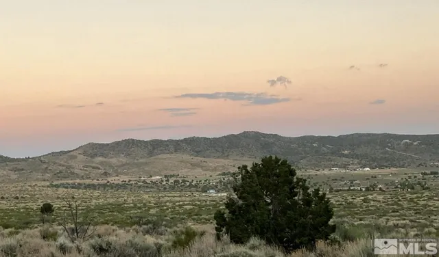 a view of mountain with lake view