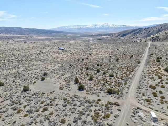 a view of a dry yard covered with snow on the wall