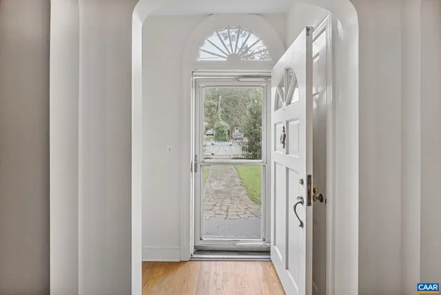 a view of entryway with wooden floor